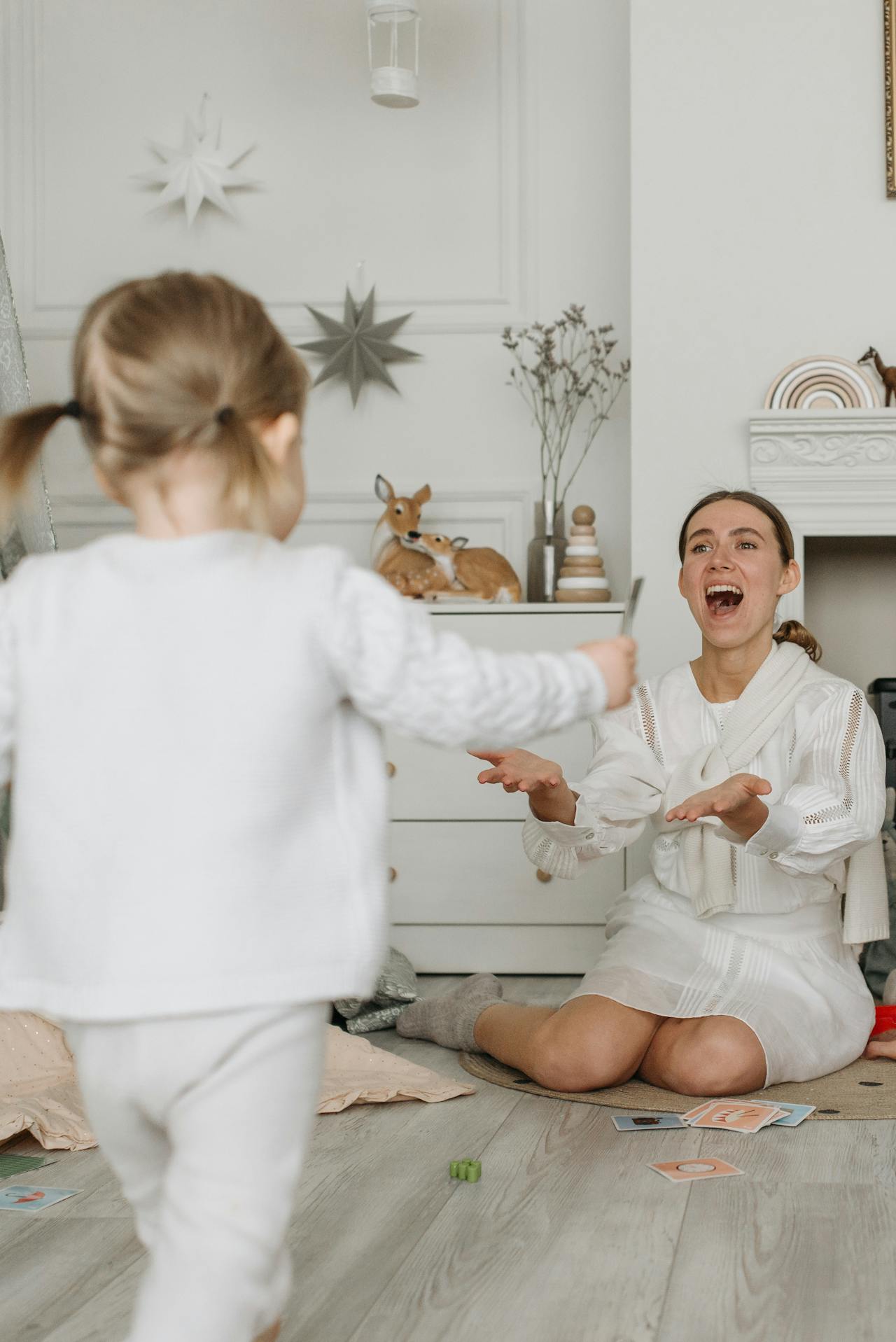 Photo of mom playing with small child used to illustrate the post Play Therapy techniques parents can use