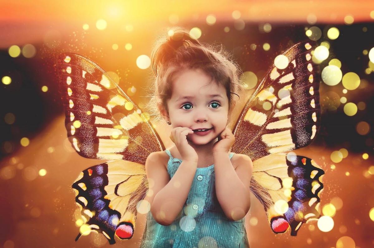 Picture of young girl with imaginary butterfly wings used to illustrate the article on guided meditation for kids: benefits and techniques